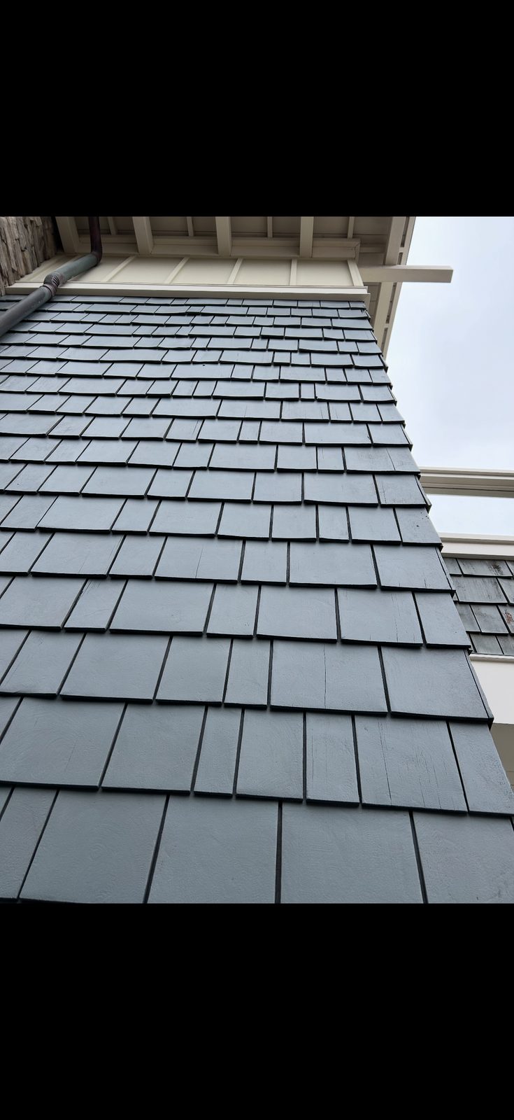 Exterior shake siding painted slate blue-gray